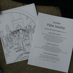 Photo of the Palm Sunday Holy Week Card. One side has a picture of Jesus entering Jerusalem. The other side has text.