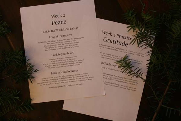 Photo of advent cards. The first page is titled "Week 2 Peace," and contains sections: Look in the Word, Look at the Picture, Look in your Heart, and Prayer. The second page shows Week 2 Spiritual Practice, Gratitude.